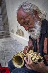 Miguel Preparing his Saxophone on the streets of Oaxaca